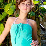 Pic of Petite nubile teen removes her bikini showing her neat little runway strip