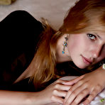 Pic of Beautiful teen cutie in sexy black stockings showing her tasty shaved pussy and ass on bed.