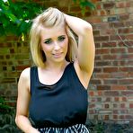 Pic of Busty blonde Jodie Piper rops her dress in the backyard (Cosmid)