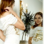 Pic of Natalia and her captivating reflection in a vanity mirror makes an erotic twin vision of a smoking hot babe.