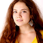 Pic of Norma A in bright yellow bodycon dress