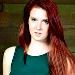 Pic of SexPreviews - Ashley Lane redhead is bound in dungeon with leather mask and dribbling