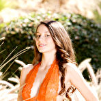 Pic of Rilee Marks takes her sexy orange dress outdoors and fingers her hungry wet meast hole. - TheMetArt.com