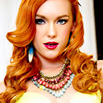 Pic of Dani Jensen peels off her sexy yellow lingerie on the sofa