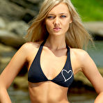 Pic of Skinny Naked Blonde Posing On A Rocky Shore