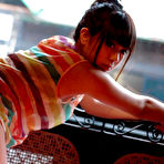 Pic of When the weather is bad, it's nice to stay indoors. Especially with a cute Japanese girl like Mina in a tiny thong next to you while playing video games.