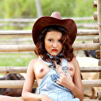 Pic of Asian Cowgirl Stripping On The Ranch