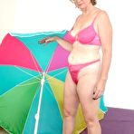 Pic of Chubby Loving - Mature Plumper Teasing Near Umbrella