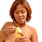 Pic of Big Titty Asian Girl eats ripe fruit