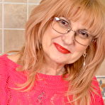 Pic of mature lady playing in the kitchen