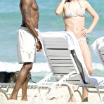 Pic of Doutzen Kroes see through on the beach paparazzi shots