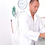 Pic of Brunette hottie gets an extra service from her horny doctor