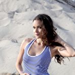 Pic of Stunning And Busty Girl Strips In The Sand