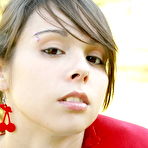 Pic of Ariel Rebel - Sporty and sexy Ariel Rebel lies down on a lawn and shows her clean shaved pussy.