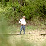 Pic of Nice ass blonde babe with shaved pussy takes a piss outdoors