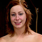 Pic of SexPreviews - Charlie Ann redhead bent over bound in wooden stocks her ass spanked red