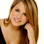 Pic of Joanna Levesque posing in jeans and black top