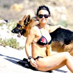 Pic of Kelly Carlson sexy in bikini on the beach with her dog
