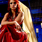 Pic of SexPreviews - Nicki Hunter mistress in red latex dress fingering her beautiful shaved pussy