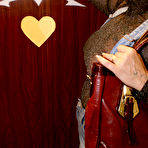 Pic of Kinky mature slut sucking through the gloryhole