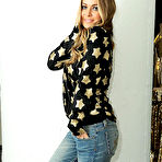 Pic of Carmen Electra non nude posing ib various apartments photoshoots