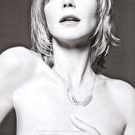 Pic of Heidi Klum posing for magazines topless but covered