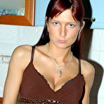 Pic of Amateur Sara strips in a kitchen then use a monster plastic cock