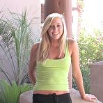 Pic of Petite blonde posing and fondling her ass and tits