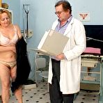 Pic of Fifty years old blond gets her hairy pussy opened when gyno checked