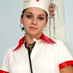 Pic of Nurse Nelia masturbating in a gyno office using dildo and speculum to open her pussy wide