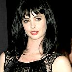 Pic of Krysten Ritter posing in short black dress