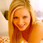 Pic of A lovely blonde babe masturbating with a red vibrating toy to climax
