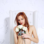 Pic of Slim red haired cutie poses naked on a chair showing her tiny boobies and her bald snatch. - TheMetArt.com