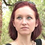 Pic of Very cute redhead posing her perky tits outdoor