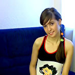 Pic of Teen Stars Only Long haired brunette teen sucking a big cock on her knees