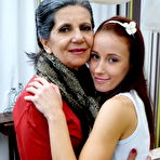 Pic of Naughty mature lesbian fooling around with a hot teeny babe