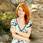 Pic of Incredible redhead Mia Sollis displays her stunning figure outdoors on the beach after stripping.