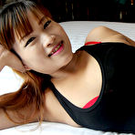 Pic of Big round and brown Thai ass parted and pussy stuffed with white cock