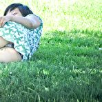 Pic of Spy upskirt of asian brunette in green dress. Upskirt gallery