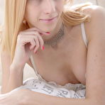 Pic of Teen in white lingerie masturbates her cunt