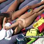 Pic of Two couples of nudists sunbathing on a large air mattress