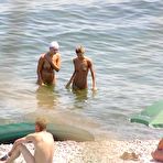Pic of Naughty young nudists play with each other in sand