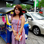 Pic of Cute Thai babe lifts dress to show juicy ass and wet pussy