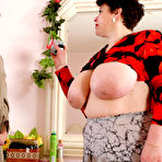 Pic of Mature fatty with big jugs giving tit fuck getting crammed by a hung lad