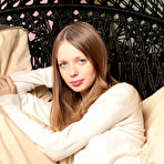 Pic of Marvelous long haired beauty stripping and showing her tantalizing pussy in the cradle.