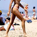 Pic of Stefania Orlando sunbathing topless on a beach