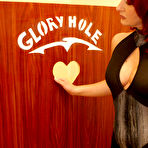 Pic of This mature slut sucks black cock through the hole