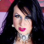 Pic of Busty MILF in stockings and sexy satin clothing shows her hairy pussy  at Trinity Productions