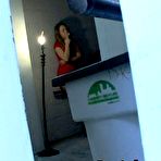 Pic of  She's taking a cigarette break, fully dressed in a tight spandex leotard, silky shiny pantyhose, and tall high heels. @ PantyhoseAddict