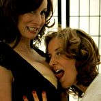 Pic of Older busty milf in stockings seduces younger girl